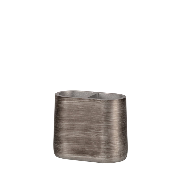 Silver | A sleek Urban Oasis Toothbrush Holder from the Taniya Nayak Collection, featuring a modern design & metallic brush stroke finish, perfect for upscale hotel bathrooms.