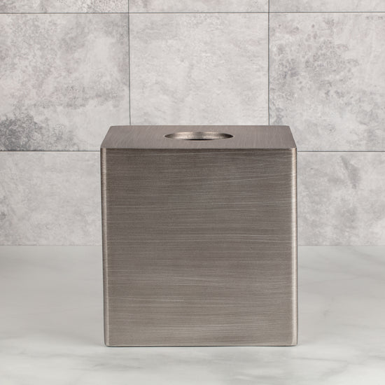 Silver | Urban Oasis tissue box holder designed with practicality in mind, making it easy to replace tissue boxes as needed.