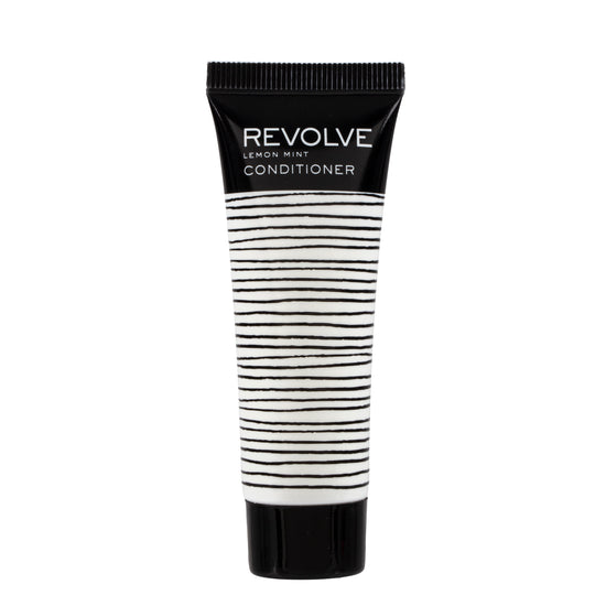 A 1oz bottle of REVOLVE: TERRAZZO Conditioner, featuring sleek design and premium formulation for a luxurious and nourishing guest hair care experience.