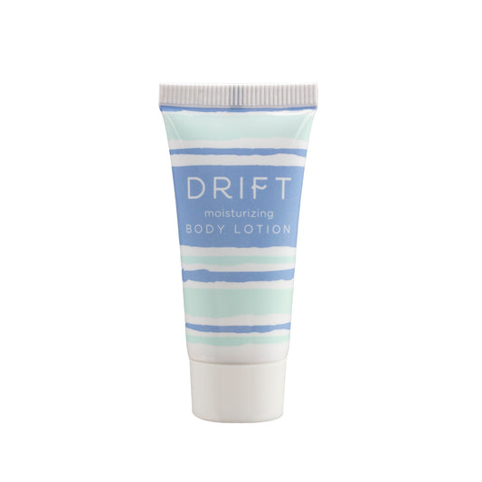 DRIFT .75oz Body Lotion in a compact bottle, providing a soothing and moisturizing experience for guests in hotel guestrooms.