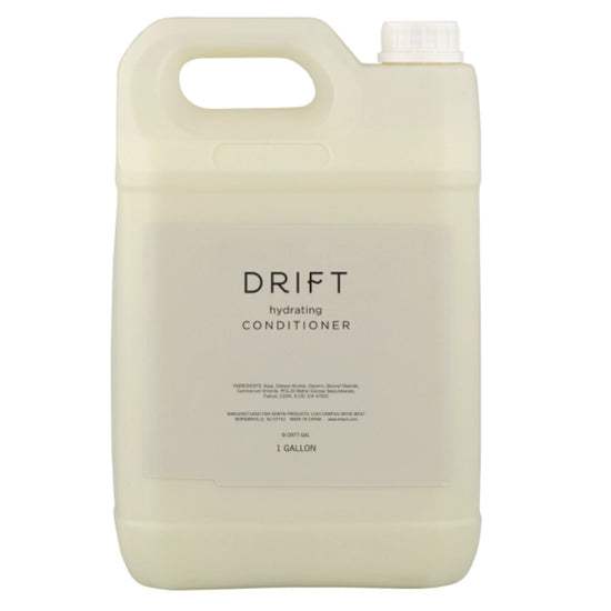 A gallon-sized container of DRIFT 1 Gallon Conditioner, ideal for refilling dispensers in hotel bathrooms, offering guests a hydrating and softening hair care experience.