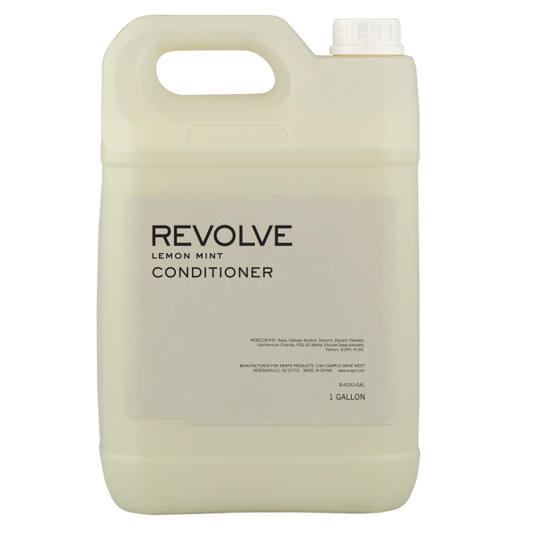 REVOLVE: TERRAZZO 1 Gallon Conditioner in a clear container, labeled with "REVOLVE: TERRAZZO" for bulk use in hospitality settings.